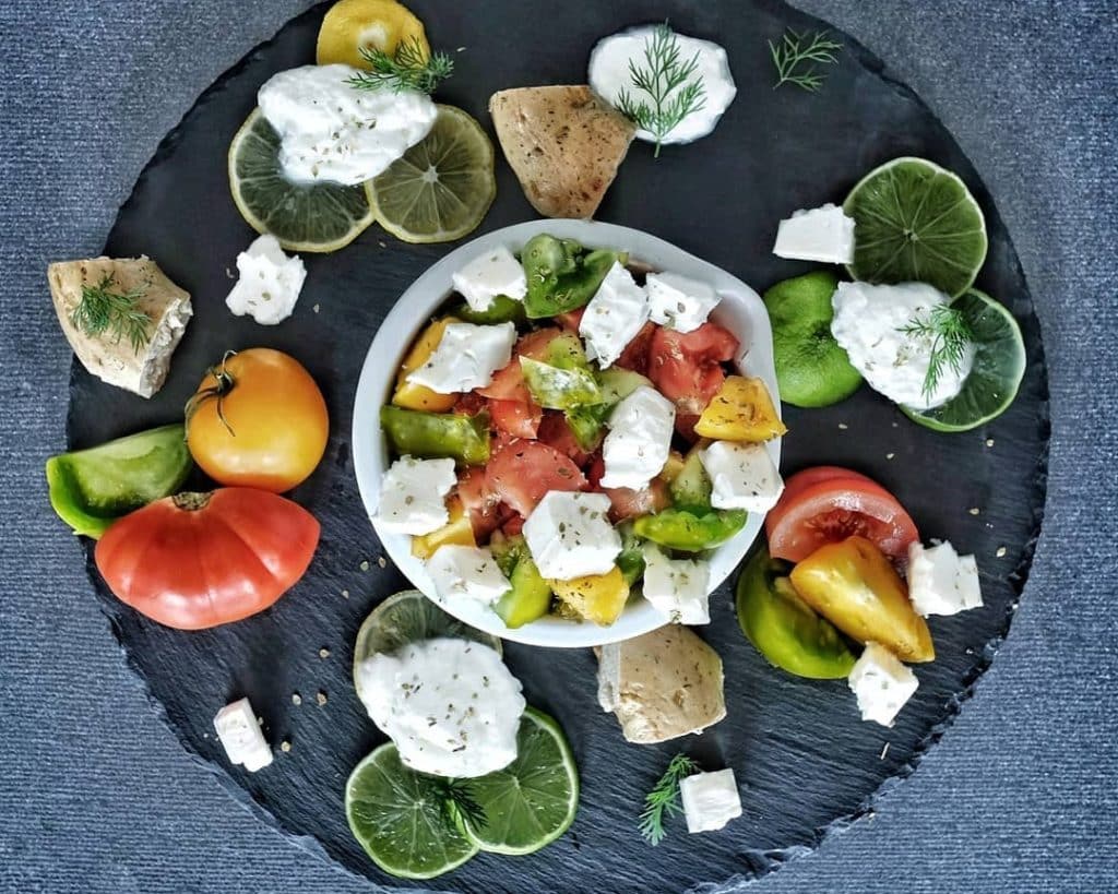 Salad platter featuring Aphrodite Feta cheese and heirloom tomatoes