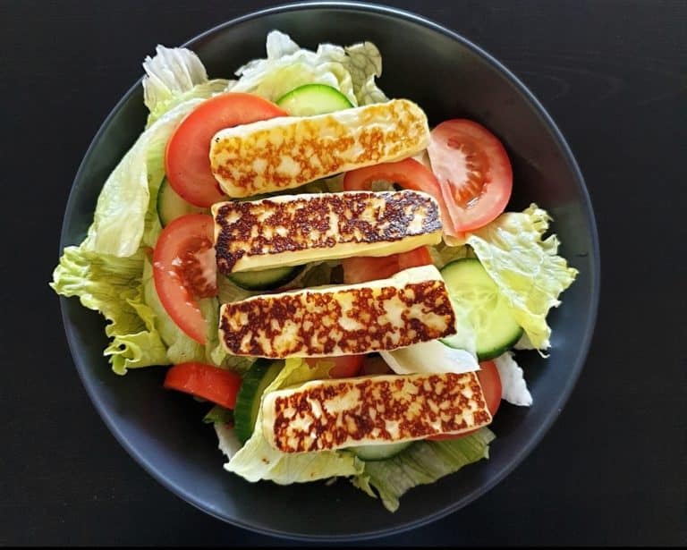 Strips of grilled L Artisan Organic Haloumi on salad