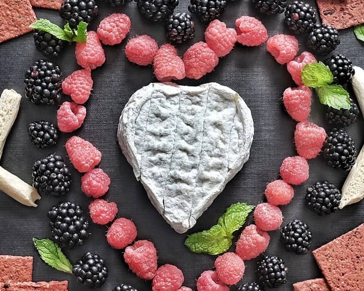 Heart shaped Coeur du Berry with raspberries