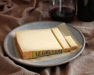 Wedge of Le Gruyère on a plate