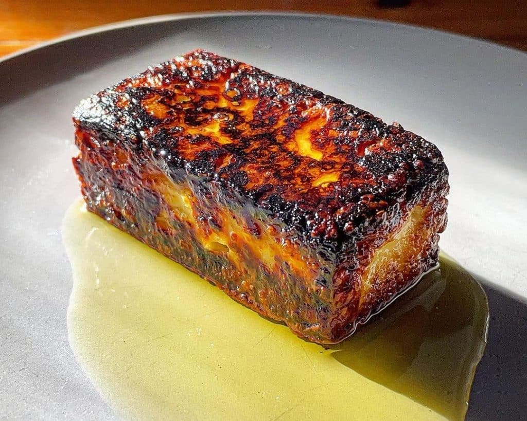 Slab of Colins Grilled Jersey Milk Cheese in olive oil