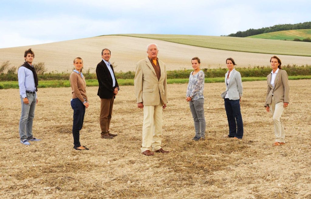 Lincet family standing on a field