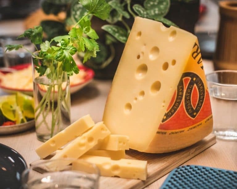 Wedge of Jarlsberg on cheese board