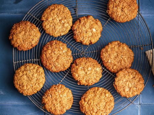 Anzac Biscuits lined up on a wire rack