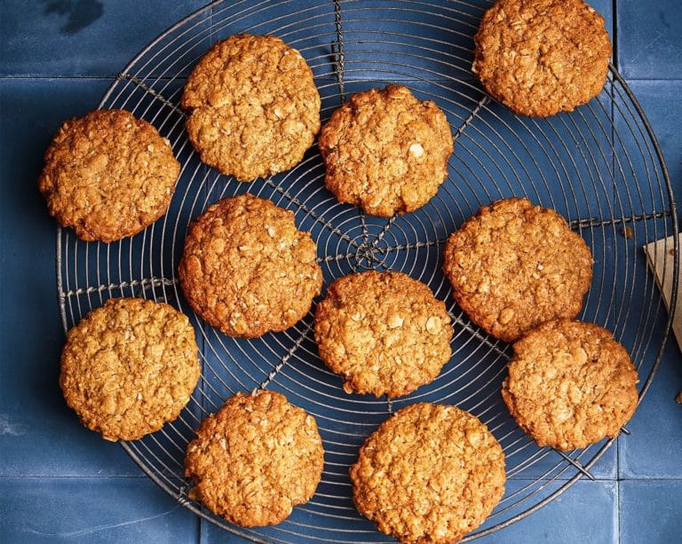 Anzac Biscuits lined up on a wire rack