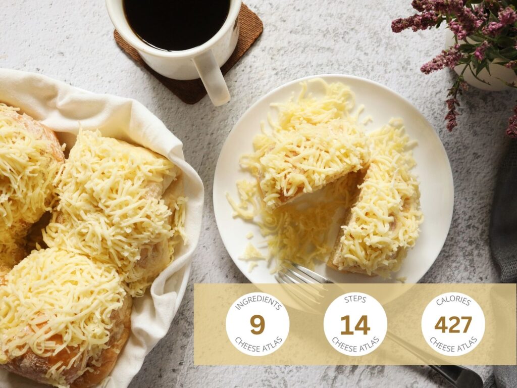 Feature Ensaymada on a white plate topped with grated cheese